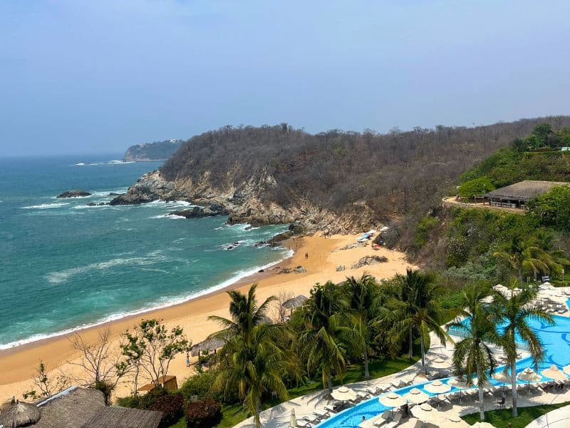 view of Bahia Conejos (Bunny Bay) and the pool at secrets resorts huatulco all inclusive