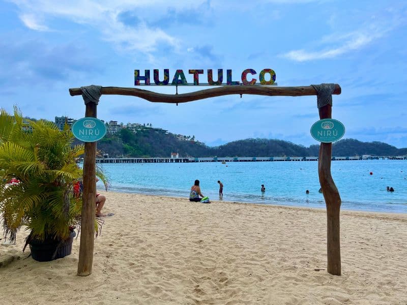 huatulco sign at playa santa cruz beach in oaxaca mexico