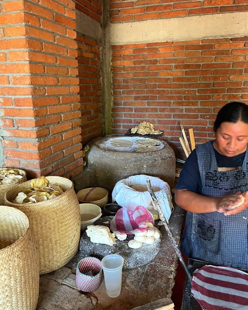woman making tortillas by hand at Restaurante Alfonsina Oaxaca Mexico
